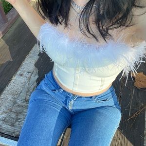 I am selling this feathered white top.
